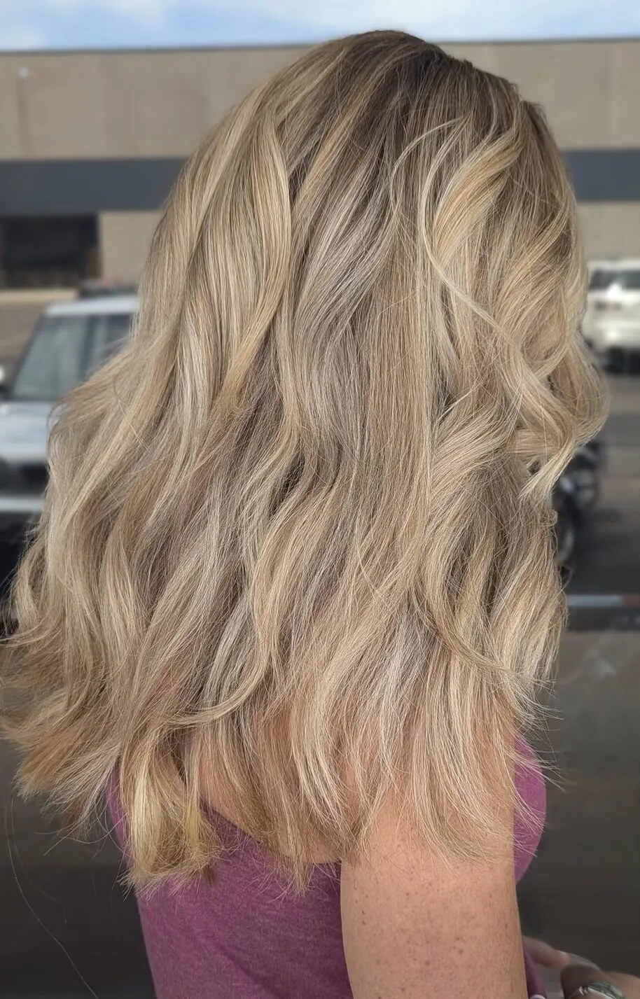 Beautiful Golden Highlights, Cut into Long Layers and Finished with a Beachy Wave Style